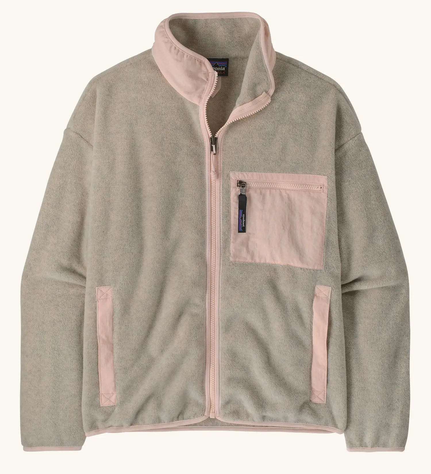 Patagonia women's synchilla fleece jacket in oatmeal heather and pink frost. Full zip jacket with zippered chest pocket and handwarmer pockets.