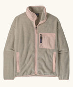 Patagonia women's synchilla fleece jacket in oatmeal heather and pink frost. Full zip jacket with zippered chest pocket and handwarmer pockets.