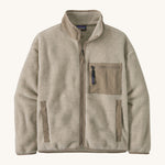 The Patagonia Women's Synchilla® Fleece Jacket in Oatmeal Heather / Seabird Grey is a pale oatmeal full zip fleece jacket with darker beige contrasting binding, patch pocket and collar. Made from Synchilla® 100% recycled fleece.
