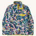 Patagonia women's synchilla fleece in a retro blue design on a cream background.