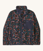 The Patagonia Women's Synchilla® Fleece Jacket in spirea/dried vanilla is a patterned full zip fleece jacket with darker blue contrasting binding  patch pocket and collar. 