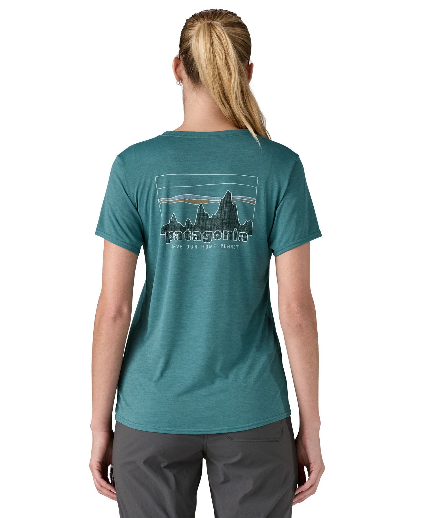 patagonia women's capilene top in a turquoise colour with logo design worn by a woman back detail