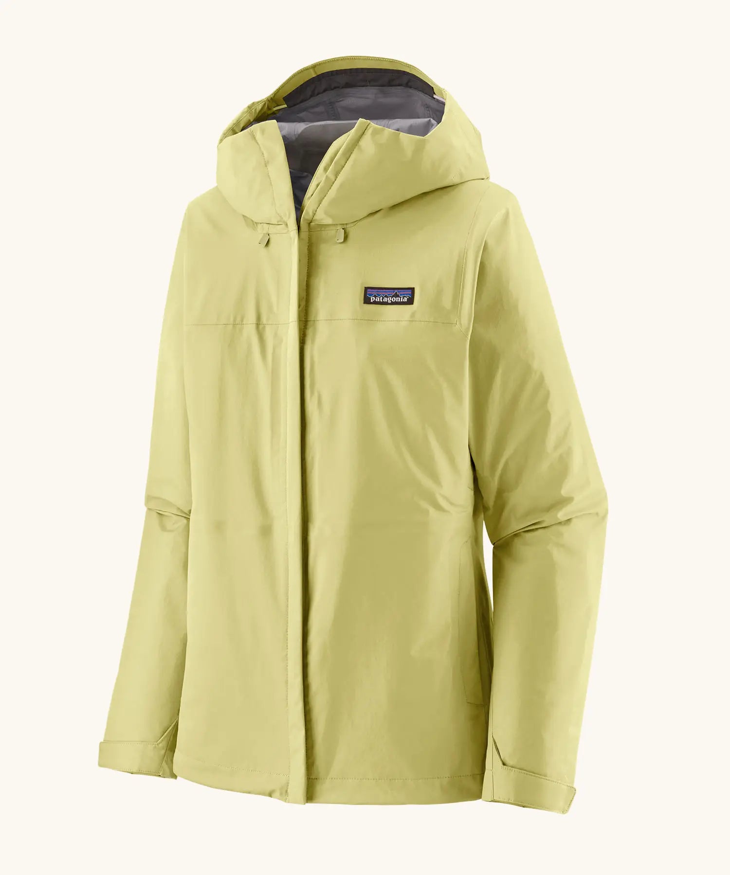Patagonia women's waterproof torrentshell 3L rain jacket in light vellum green with adjustable hood, zippered handwarmer pockets.