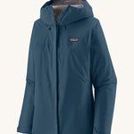 Patagonia Women's Torrentshell 3L Rain Jacket in a Lagom Blue colour on a plain background. 