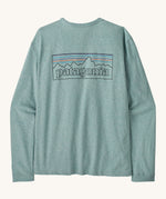 Patagonia women's outline responsibili top. A blue, long sleeve t-shirt showing the big brand logo printed on the front.