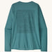 Patagonia women's long sleeve capilene top in turquoise mountain outline design on a cream background.