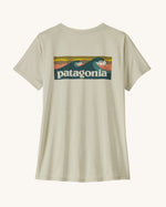Patagonia women's warm off white capilene short sleeved t-shirt with boardshort logo across the back. 