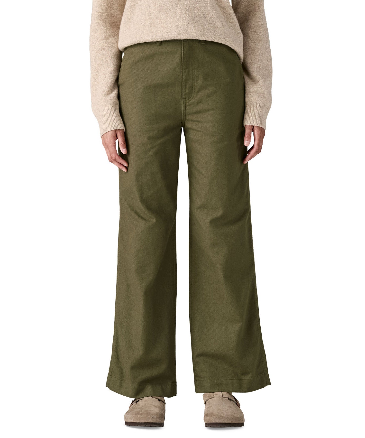 An adult wearing the Patagonia women's trousers in basin green showing the wide leg fit 