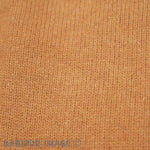 Patagonia Women's Recycled Wool-Blend Hooded Sweater - Dried Mango. Material detail close-up shot.