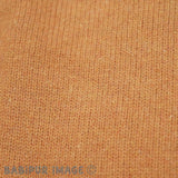 Patagonia Women's Recycled Wool-Blend Hooded Sweater - Dried Mango. Material detail close-up shot.