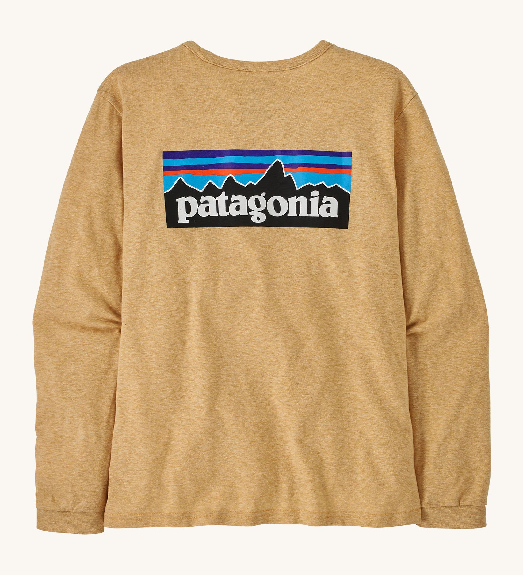Patagonia yellow tan long sleeve top on a cream background.