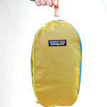 showing inside mesh side pocket with some examples of typical wash things you could put inside.