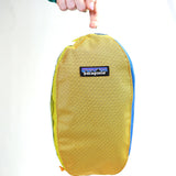 showing inside mesh side pocket with some examples of typical wash things you could put inside.