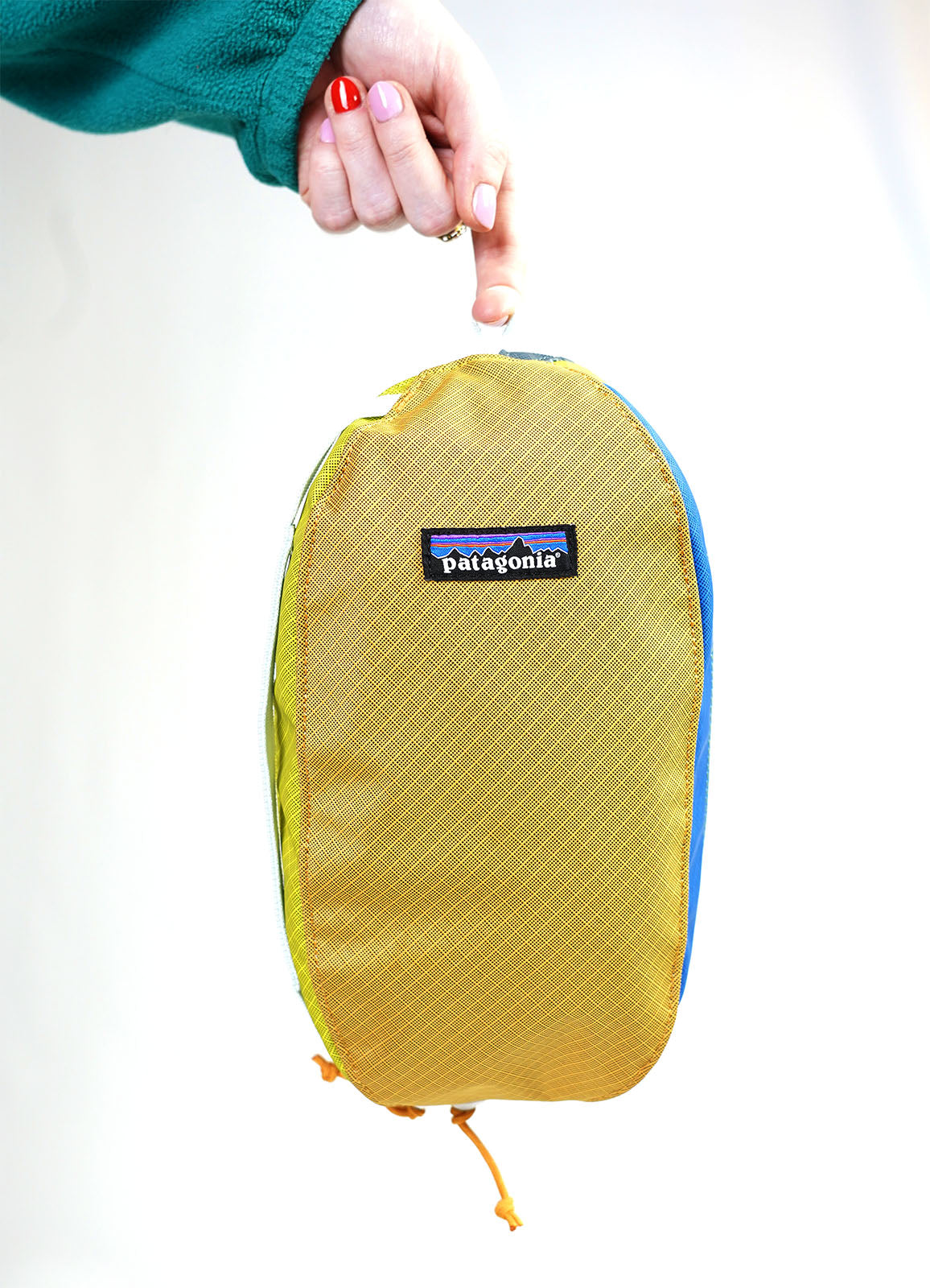 showing inside mesh side pocket with some examples of typical wash things you could put inside.