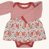Pigeon Organics squirrel baby dress. A pale rust striped top and printed woven skirt on 100% GOTS organic cotton fabric. Features poppers at the crotch for easy changing.