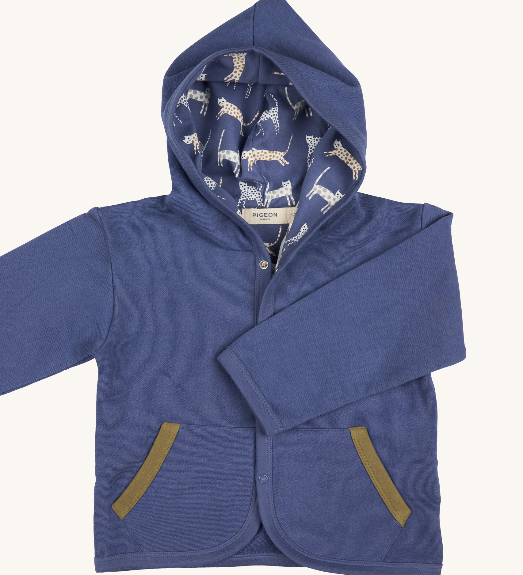 Pigeon Organics baby jacket in velvet blue. 100% GOTS organic cotton hooded jacket with popper fasteners, side pockets and a printed inner hood lining