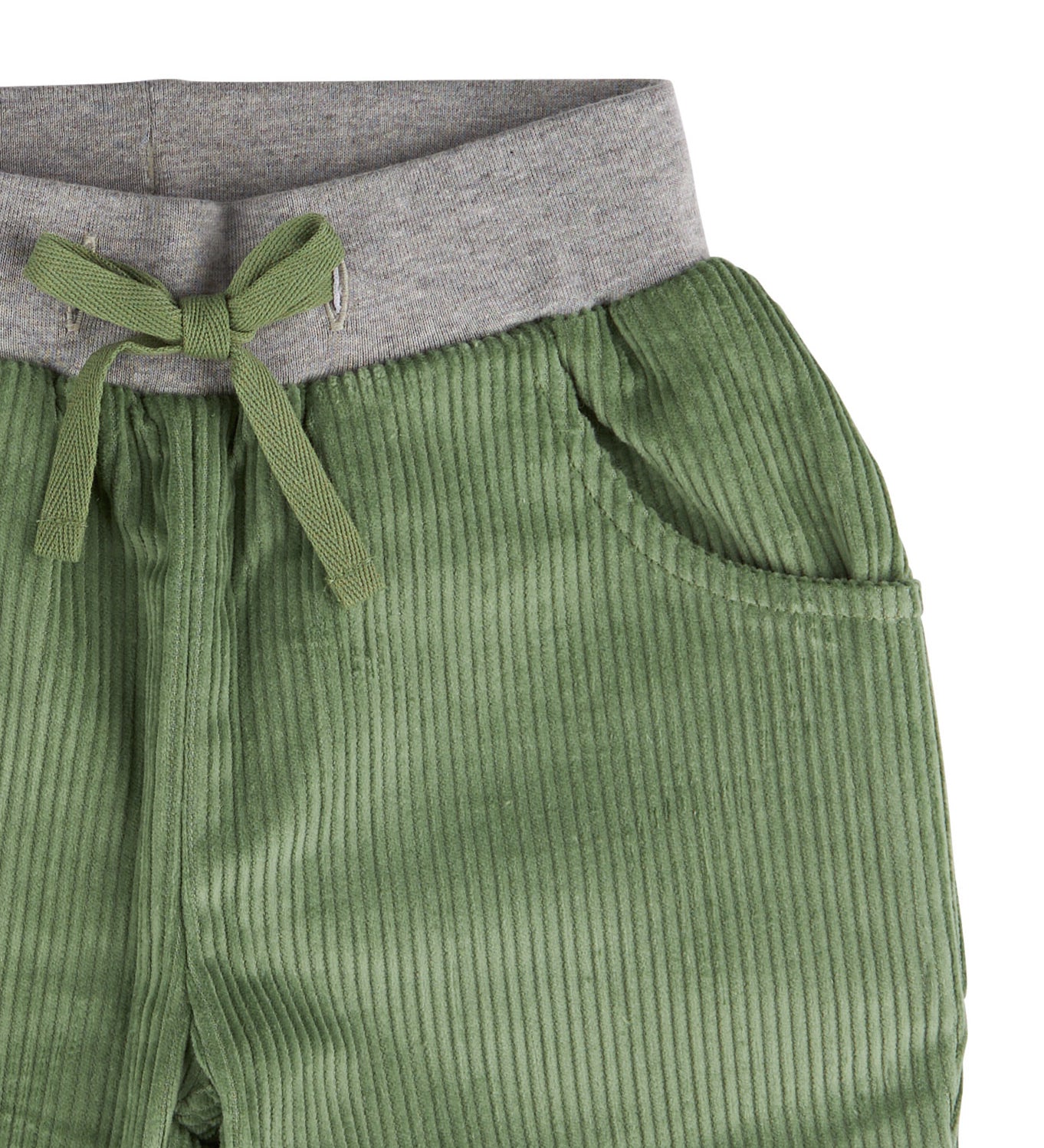 A close up of the Pigeon Organics lined cord trousers available at Babipur showing the grey elasticated waistband and green drawstring detail