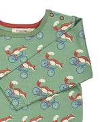 A close up of the green cycling fox striped Pigeon organics long sleeve top available at Babipur showing the popper fastener detail on the shoulder