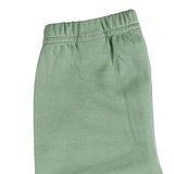 A close up of the Pigeon Organics green leggings available at Babipur showing the elasticated waistband detail