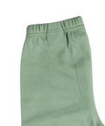 A close up of the Pigeon Organics green leggings available at Babipur showing the elasticated waistband detail