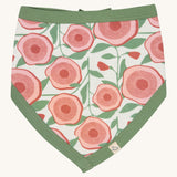 Pigeon Organics bib. 100% GOTS organic cotton bib with a pink floral design  and pale green trim.