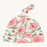 Pigeon Organics knotted baby hat - 100% GOTS organic neutral coloured hat with a top knot. Features multiple prints of pale pink flowers with green leaves.