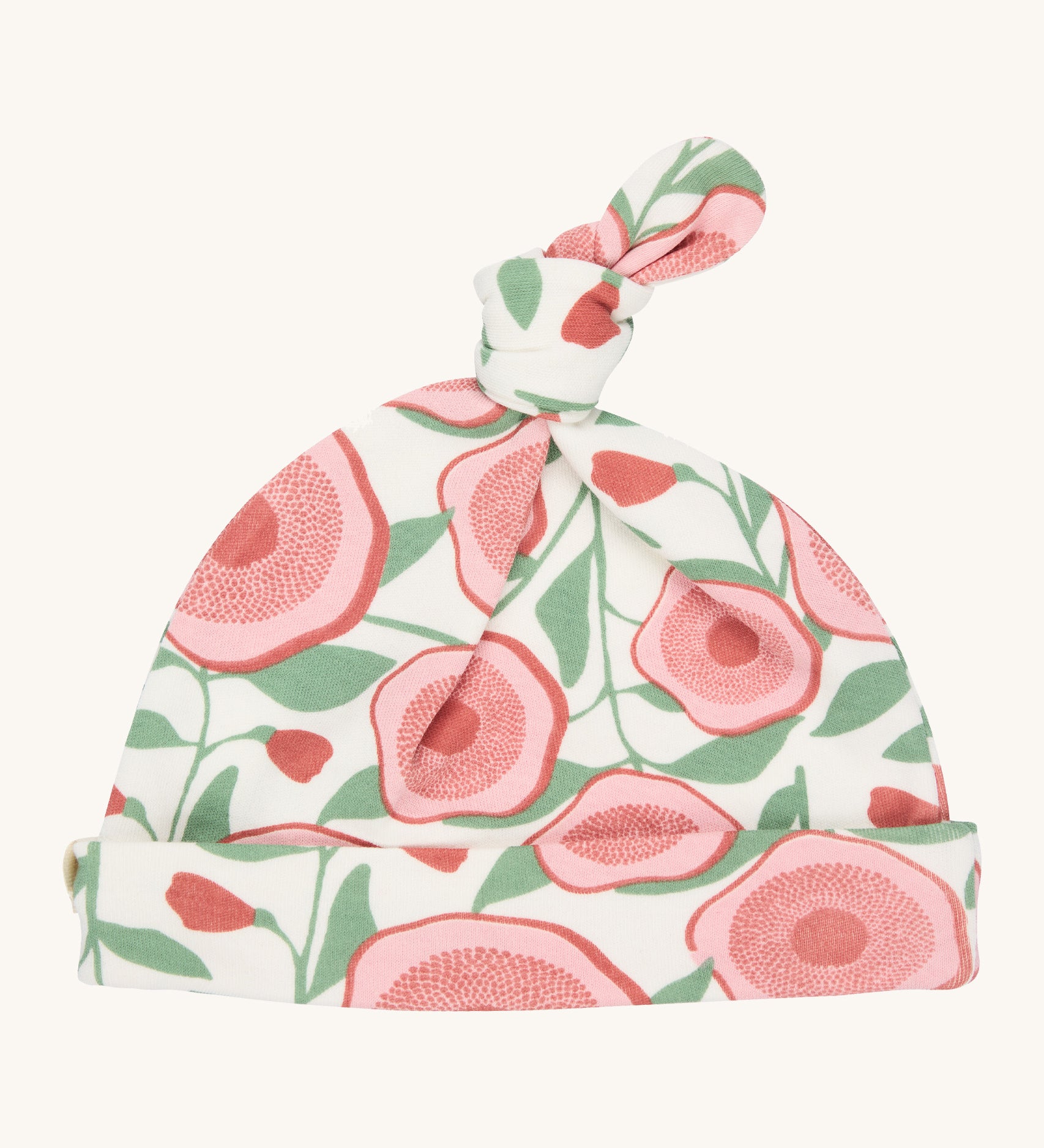 Pigeon Organics knotted baby hat - 100% GOTS organic neutral coloured hat with a top knot. Features multiple prints of pale pink flowers with green leaves.