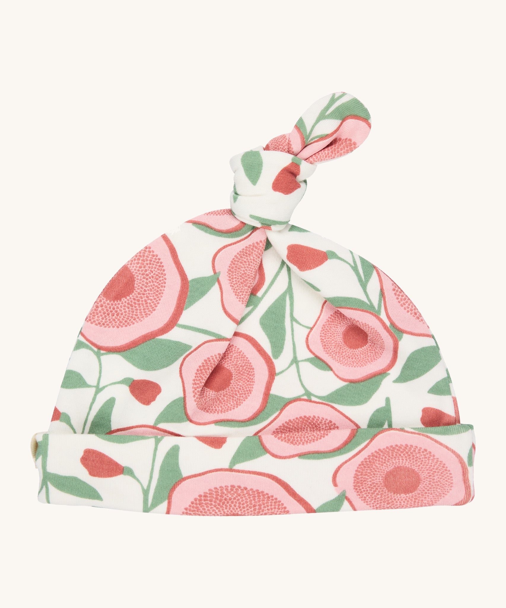Pigeon Organics knotted baby hat - 100% GOTS organic neutral coloured hat with a top knot. Features multiple prints of pale pink flowers with green leaves.