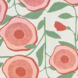 Close up of the Pigeon Organics large floral design printed on neutral coloured organic cotton fabric