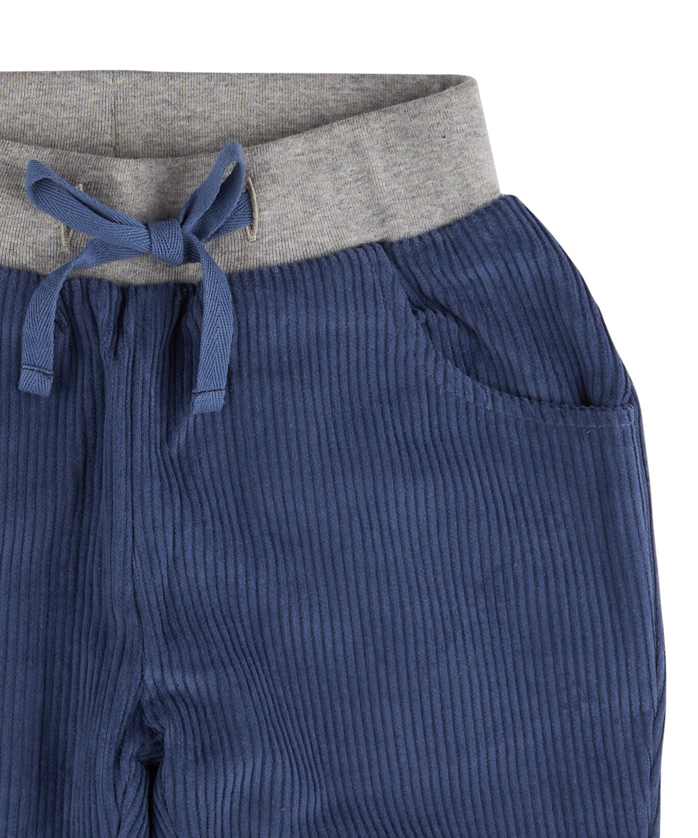 A close up of the Pigeon Organics lined cord trousers available at Babipur showing the grey elasticated waistband and drawstring detail