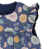 A close up of the navy winter shift print detail on the Pigeon organics winter berry dress showing the frill detail available at Babipur