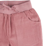 A close up of the Pigeon Organics lined cord trousers available at Babipur showing the pink elasticated detail and matching drawstring.