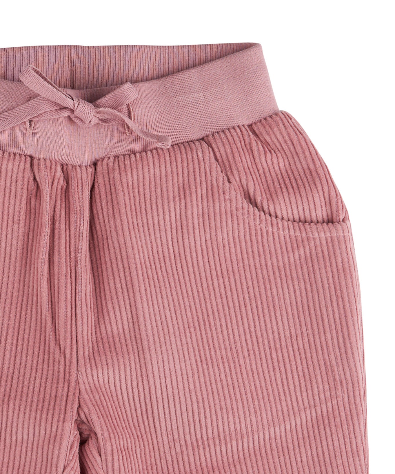 A close up of the Pigeon Organics lined cord trousers available at Babipur showing the pink elasticated detail and matching drawstring.