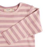 A close up of the pink breton striped Pigeon organics long sleeve top available at Babipur showing the popper fastener detail on the shoulder