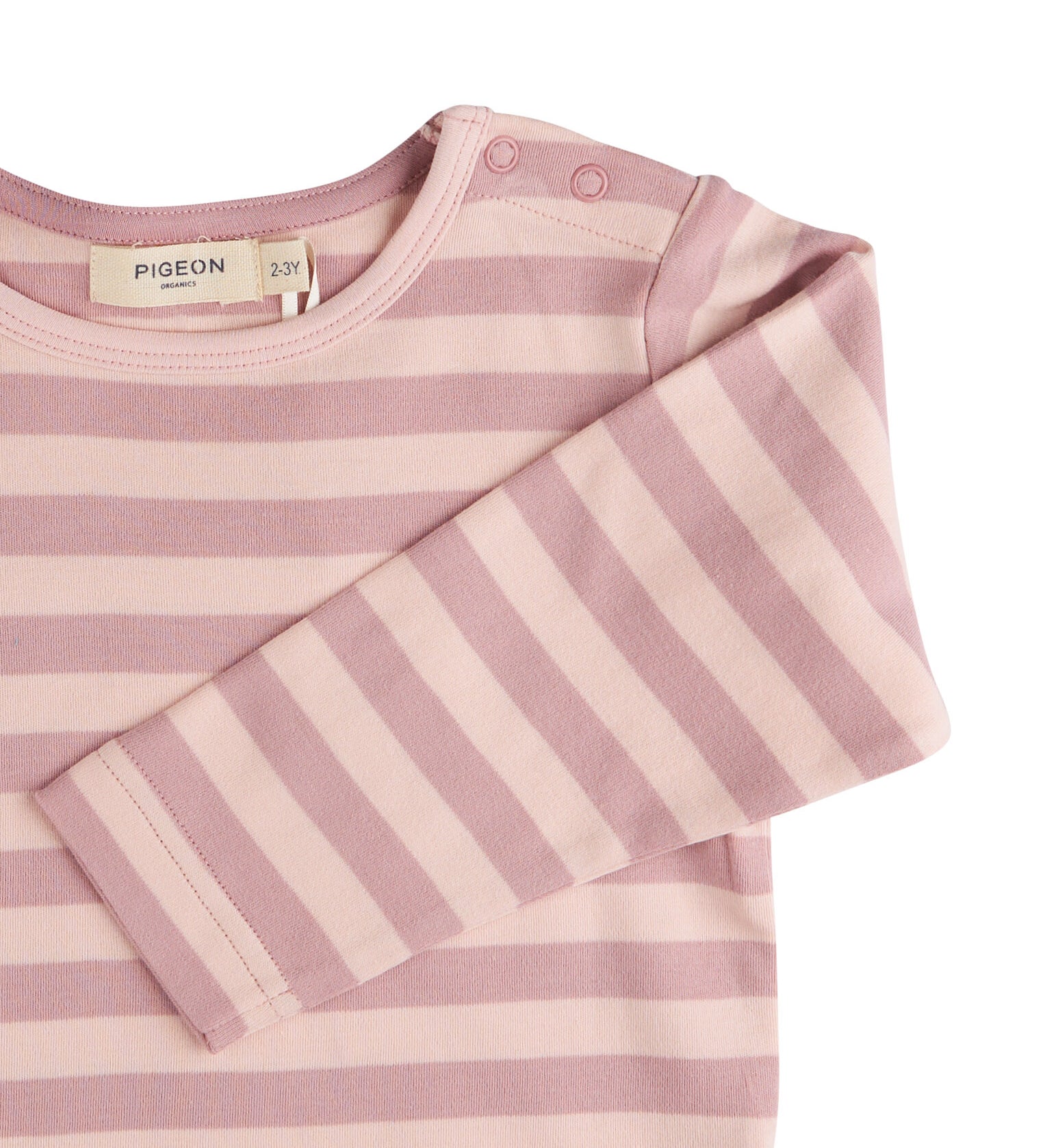 A close up of the pink breton striped Pigeon organics long sleeve top available at Babipur showing the popper fastener detail on the shoulder