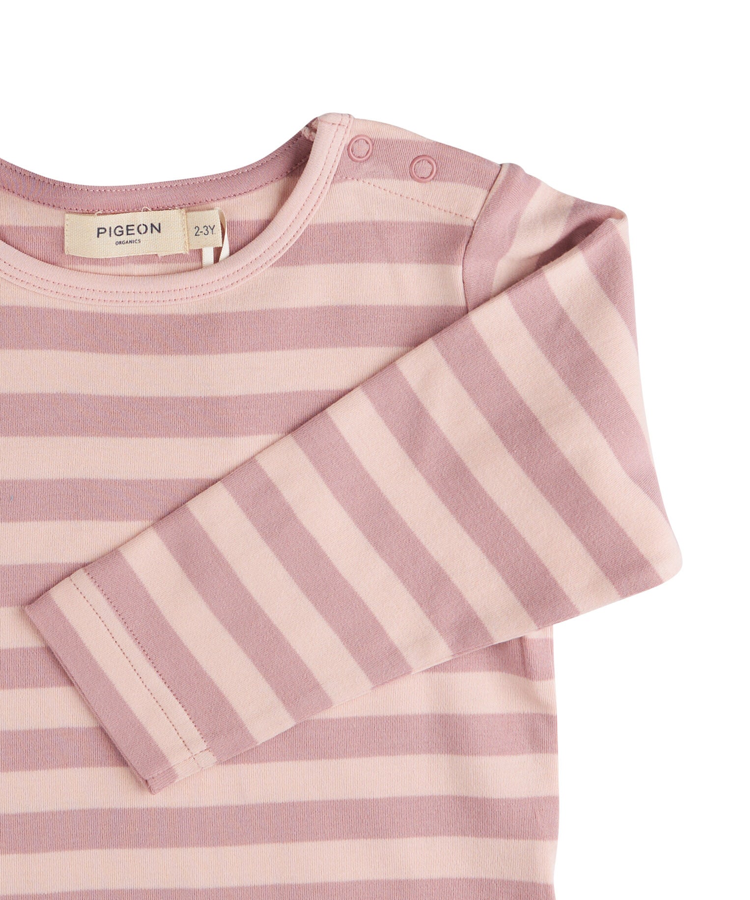 A close up of the pink breton striped Pigeon organics long sleeve top available at Babipur showing the popper fastener detail on the shoulder