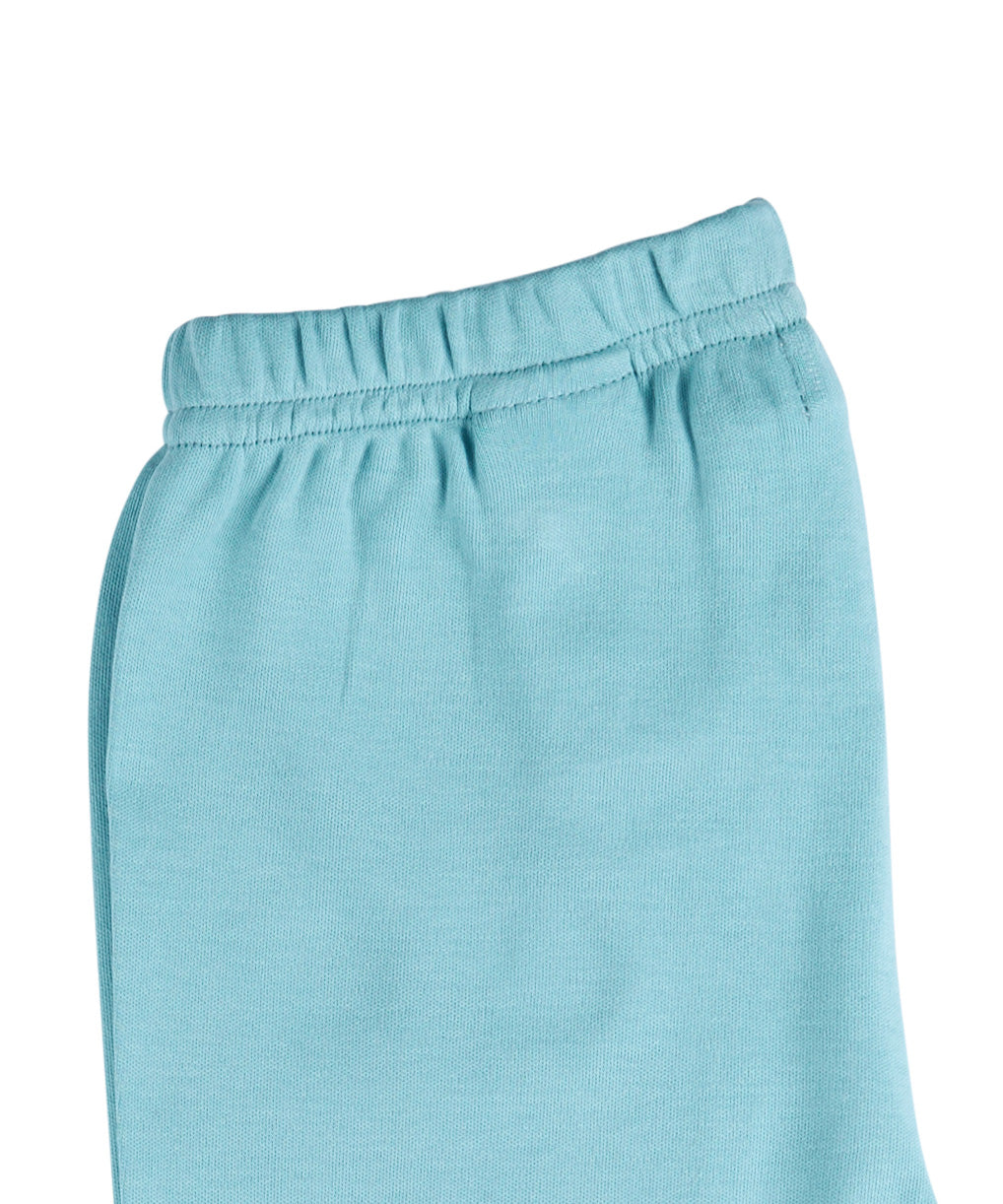 A close up of the Pigeon Organics turquoise leggings available at Babipur showing the elasticated waistband detail