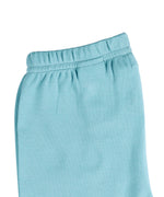 A close up of the Pigeon Organics turquoise leggings available at Babipur showing the elasticated waistband detail