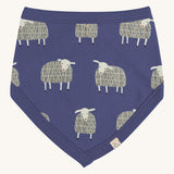Pigeon Organics bib. A 100% GOTS organic cotton bib in pale blue with a white sheep print all over