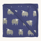 Pigeon Organics hooded blanket. A 100% GOTS organic cotton navy hooded blanket with white sheep printed all over. 