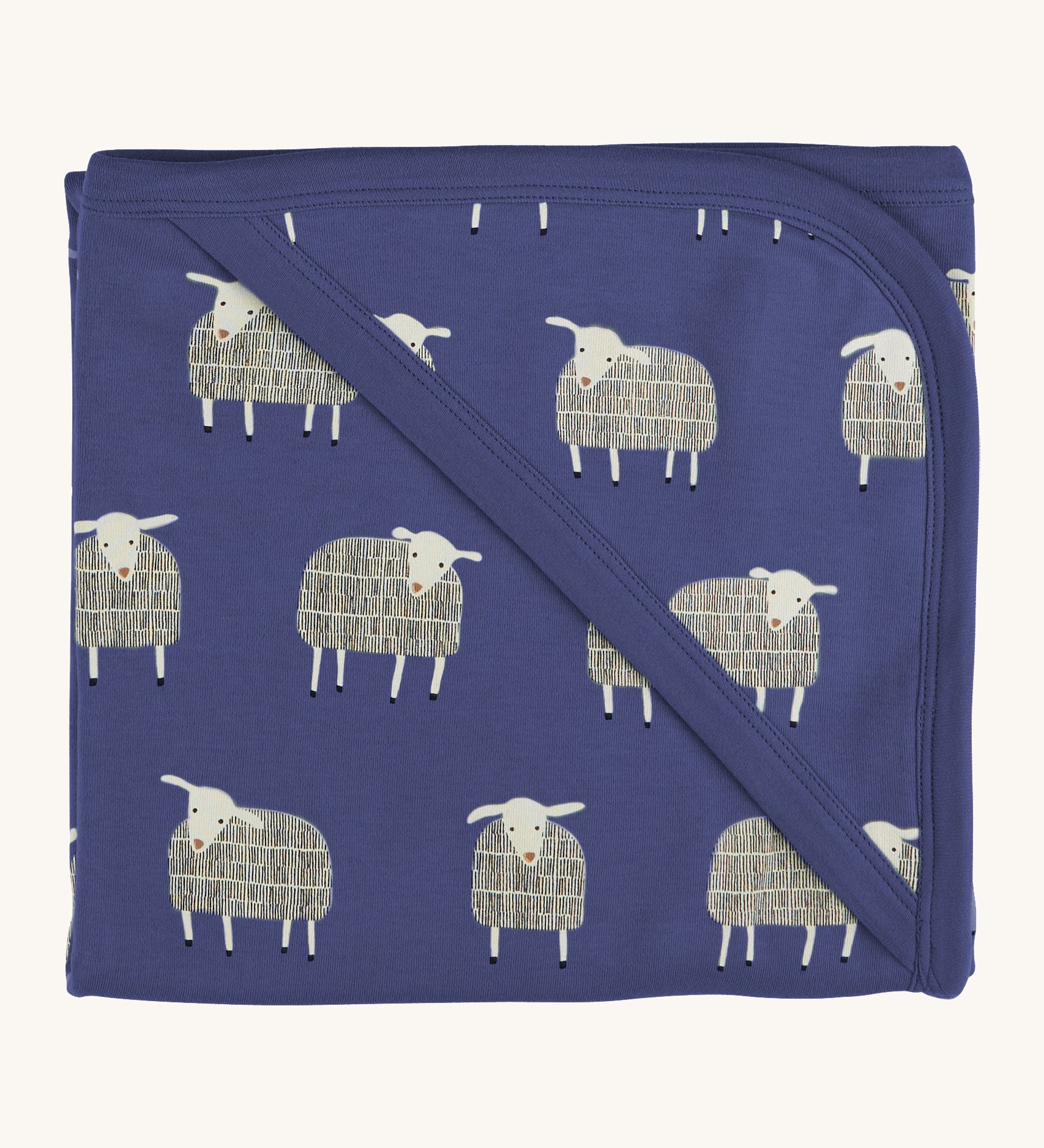 Pigeon Organics hooded blanket. A 100% GOTS organic cotton navy hooded blanket with white sheep printed all over. 