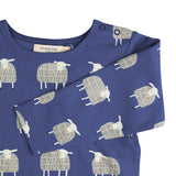 A close up of the navy sheep  Pigeon organics long sleeve top available at Babipur showing the popper fastener detail on the shoulder