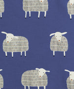 A close up of the navy sheep print on from Pigeon organics available at Babipur showing 