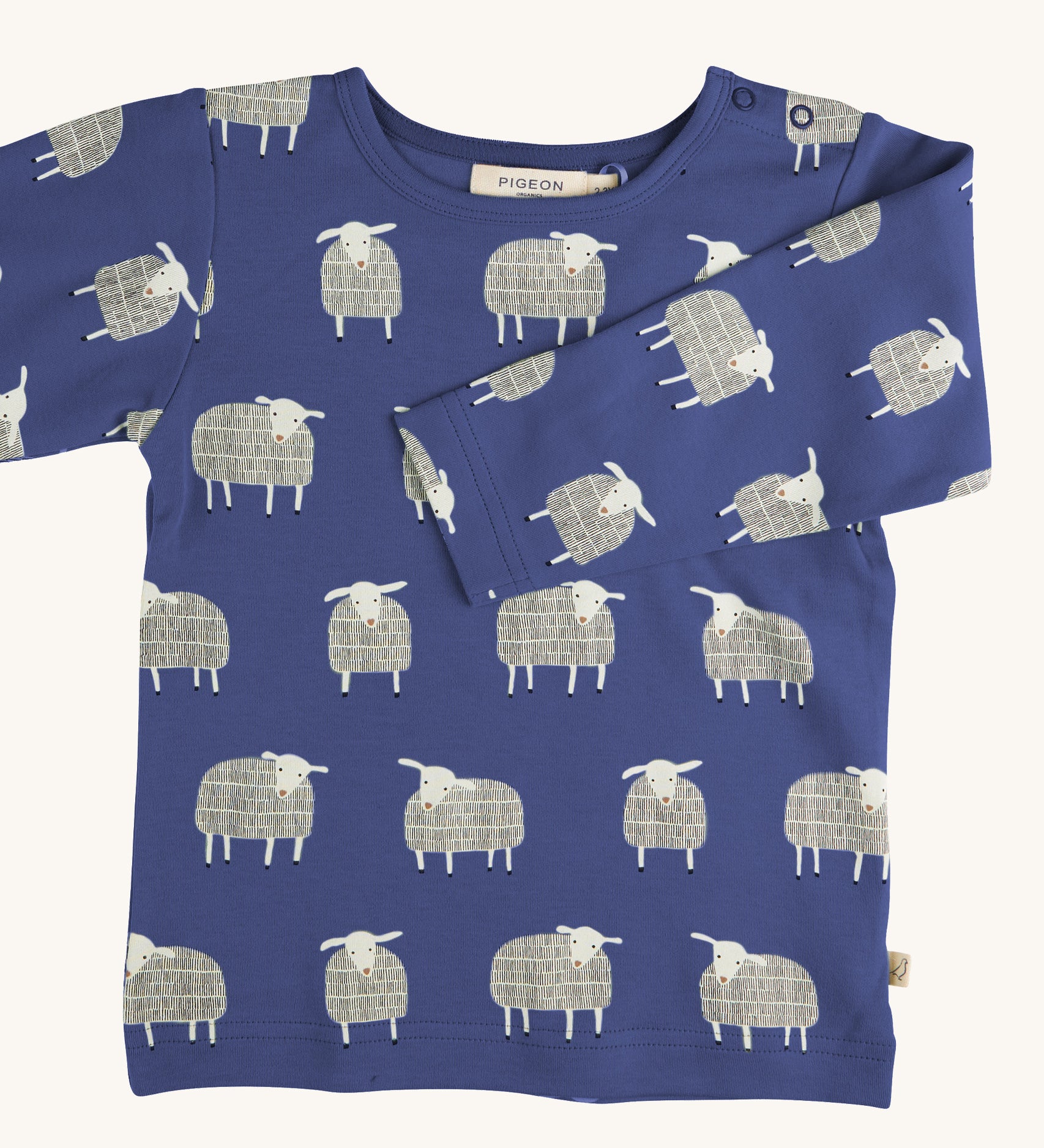 Pigeon Organics sheep t-shirt - GOTS organic cotton t-shirt with long sleeves in navy blue. Features multiple prints of a playful white sheep standing