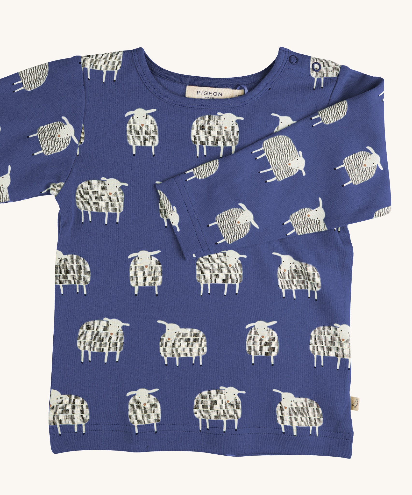 Pigeon Organics sheep t-shirt - GOTS organic cotton t-shirt with long sleeves in navy blue. Features multiple prints of a playful white sheep standing