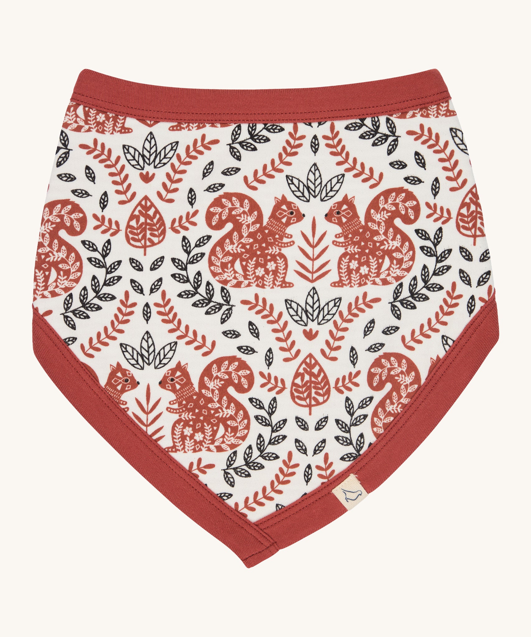 Pigeon Organics bib with a squirrel design. A 100% GOTS organic cotton bib in white with a cute floral and squirrel design printed all over. Features a pale rust trim.