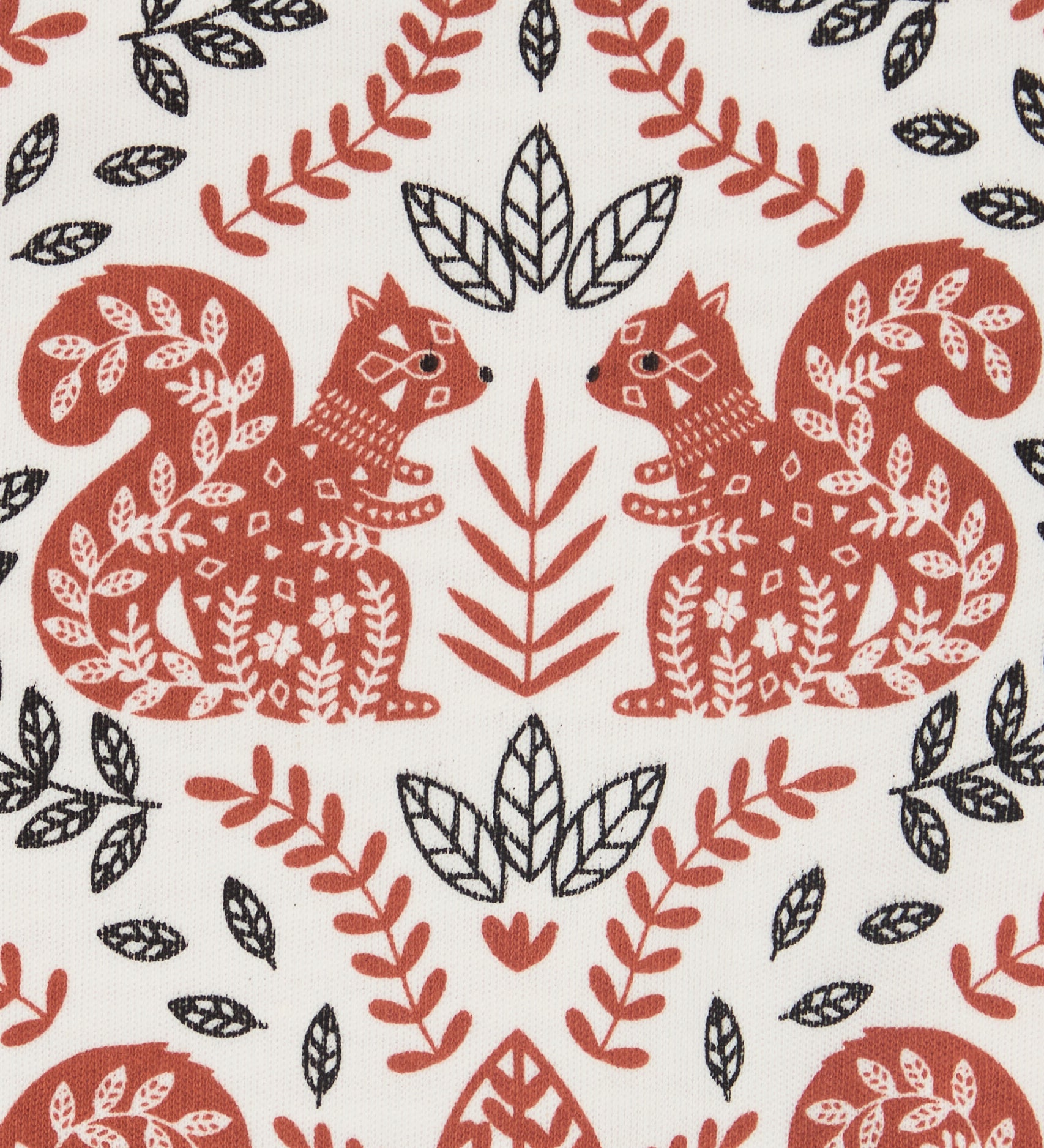 Close up of the Pigeon Organics squirrel and leaves design printed on organic neutral colour cotton fabric.