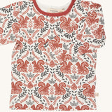 Pigeon Organics squirrel long sleeved top. A GOTS organic cotton t-shirt with long sleeves in a cream colour. Features a dark orange and black coloured print with squirrels and foliage.