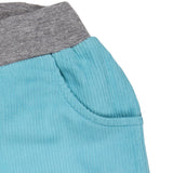 A close up of the Pigeon Organics lined cord trousers available at Babipur showing the grey elasticated waistband detail and side pocket