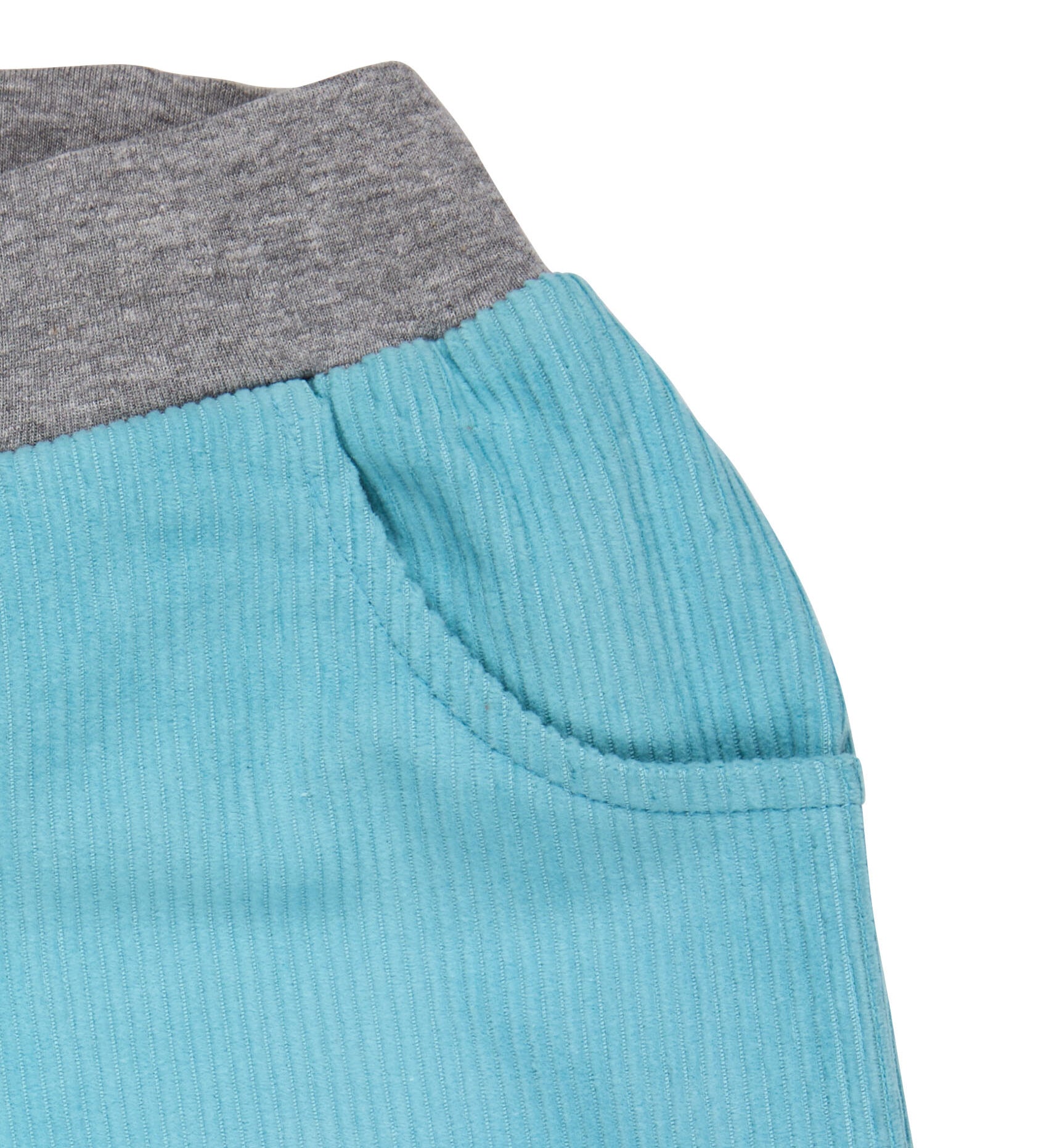 A close up of the Pigeon Organics lined cord trousers available at Babipur showing the grey elasticated waistband detail and side pocket